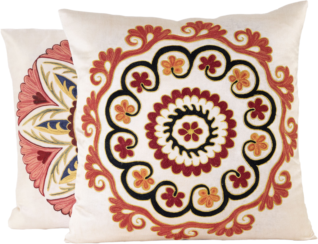 Front view of the luxurious hand-embroidered Arabesque Floral Medallion Silk cushion in maroon, black and gold with another Silk hand-embroidered cushion on the side.