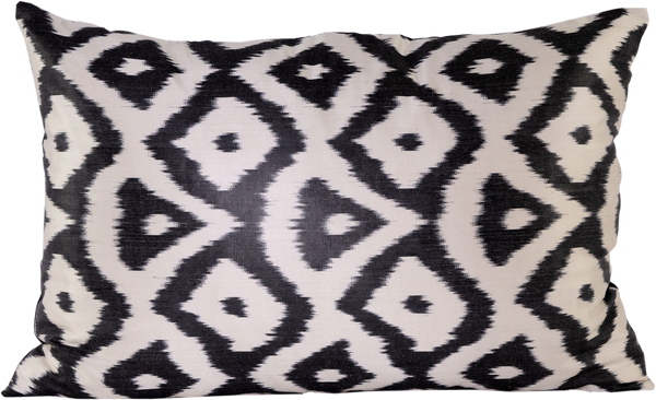 Front view of the beautiful Black and White Geometric Patterned Silk Ikat rectangle cushion made with fabric that is hand-woven and hand-dyed.