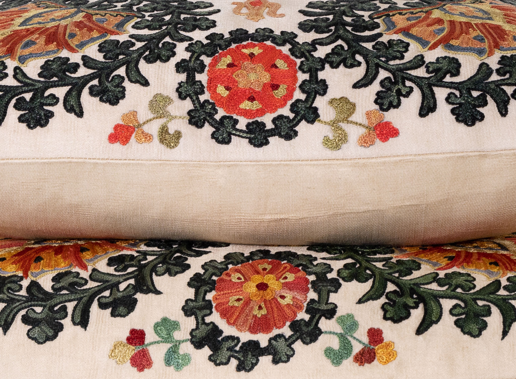 Side view of the luxurious hand-embroidered Bukhara Garden Silk cushion. 