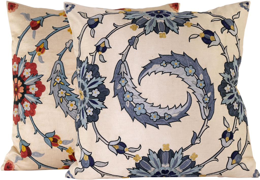 View of the two luxurious hand-embroidered Clematis Vine with Blue Flowers Silk cushion in various red and blue colour schemes. 