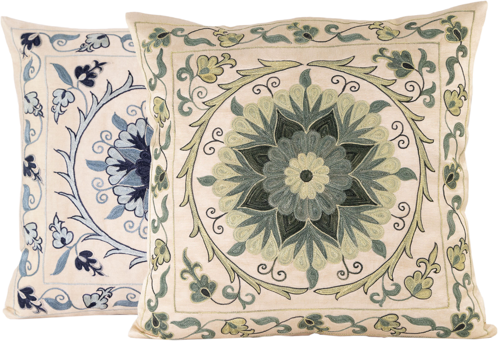 Front view of the luxurious hand-embroidered Green Pasion Flower Silk cushion with another Silk hand-embroidered cushion in blue.
