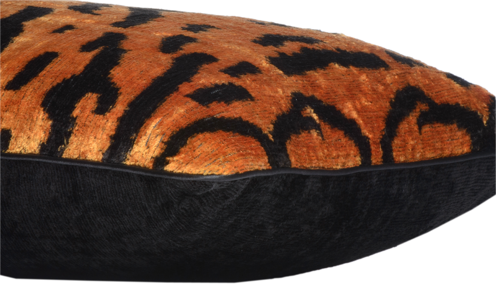 Side view of the luxurious hand-woven Silk Velvet Ikat - Tiger Print cushion in black.
