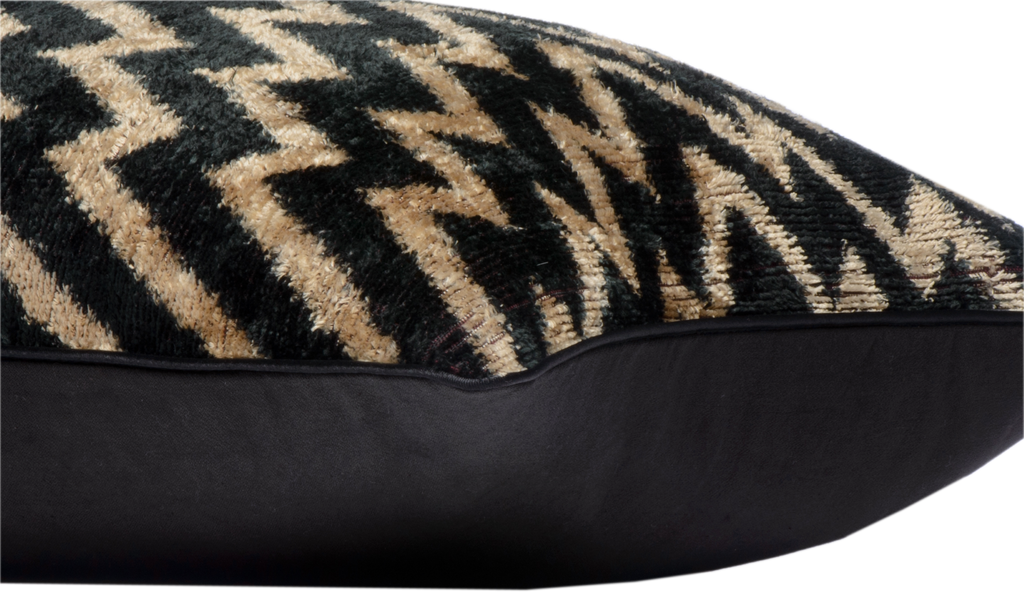 Side view of the luxurious hand-woven Silk Velvet Ikat - Black and Gold ZigZag cushion.