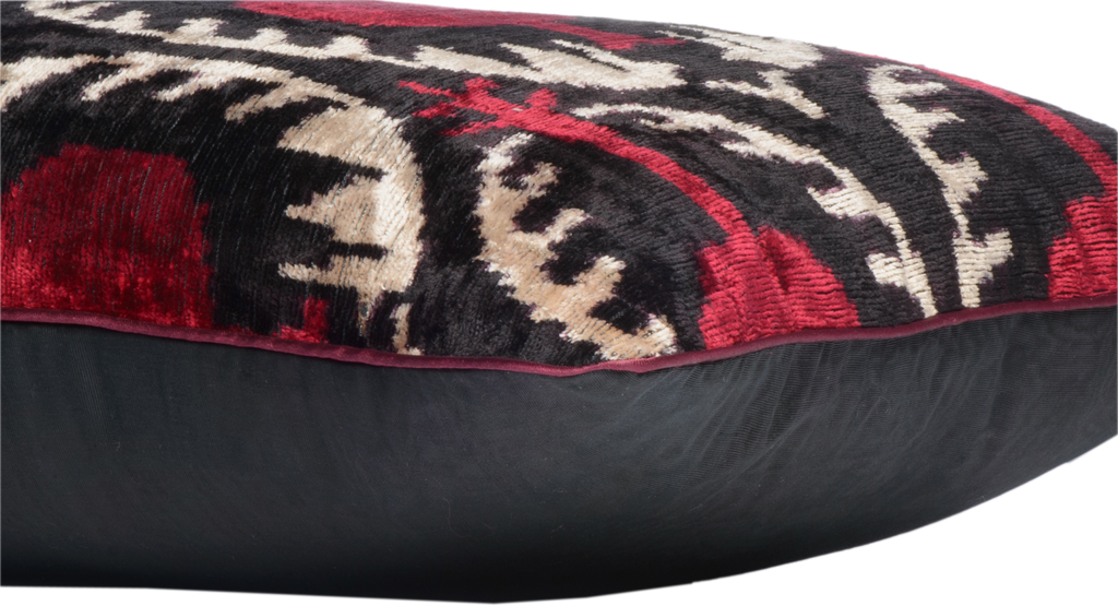 Side view of the luxurious hand-woven Silk Velvet Ikat - Pomegranate cushion.