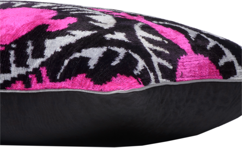 Close-up of the side view of the luxurious hand-woven Silk Velvet Ikat - Pink Pomegranate cushion.