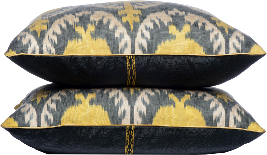 Side view of two luxurious hand-woven Silk Ikat - Yellow Pomegranate Square cushions.