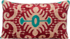 Front view of the luxurious hand-woven Silk Velvet Ikat - Red, Aqua and Cream cushion.
