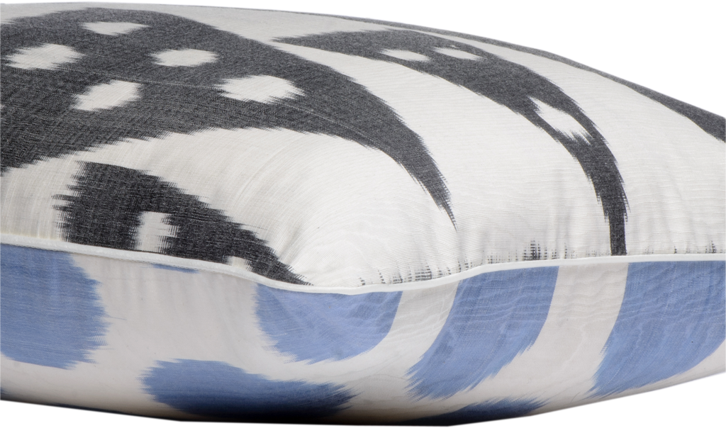 Side view of the Beautiful Black and White Geometric Pattern Rectangle Silk Ikat Cushions made with fabric that is hand-woven and hand-dyed.