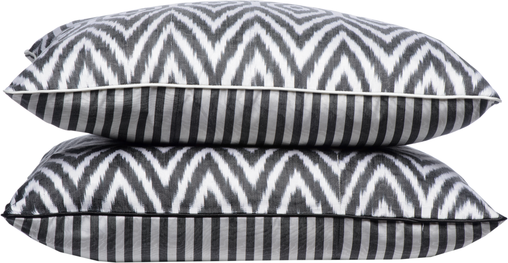 Side view of two beautiful White Geometric Pattern Silk Ikat Cushions in different sizes made with fabric that is hand-woven and hand-dyed.