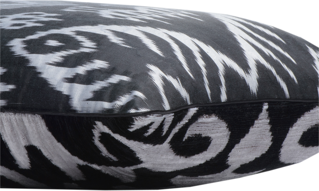 Side view of the luxurious hand-woven reversible Silk Velvet Ikat Cushion in Black and White.