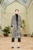 Model wearing the Silk Velvet Ikat Shawl Coat - Leopard, hand woven by the artisans of Uzbekistan