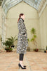 Side view of a model wearing the Silk Velvet Ikat Shawl Coat - Leopard
