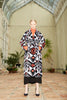Front belted view of a model wearing the Silk Velvet Ikat Shawl Coat - Sevara
