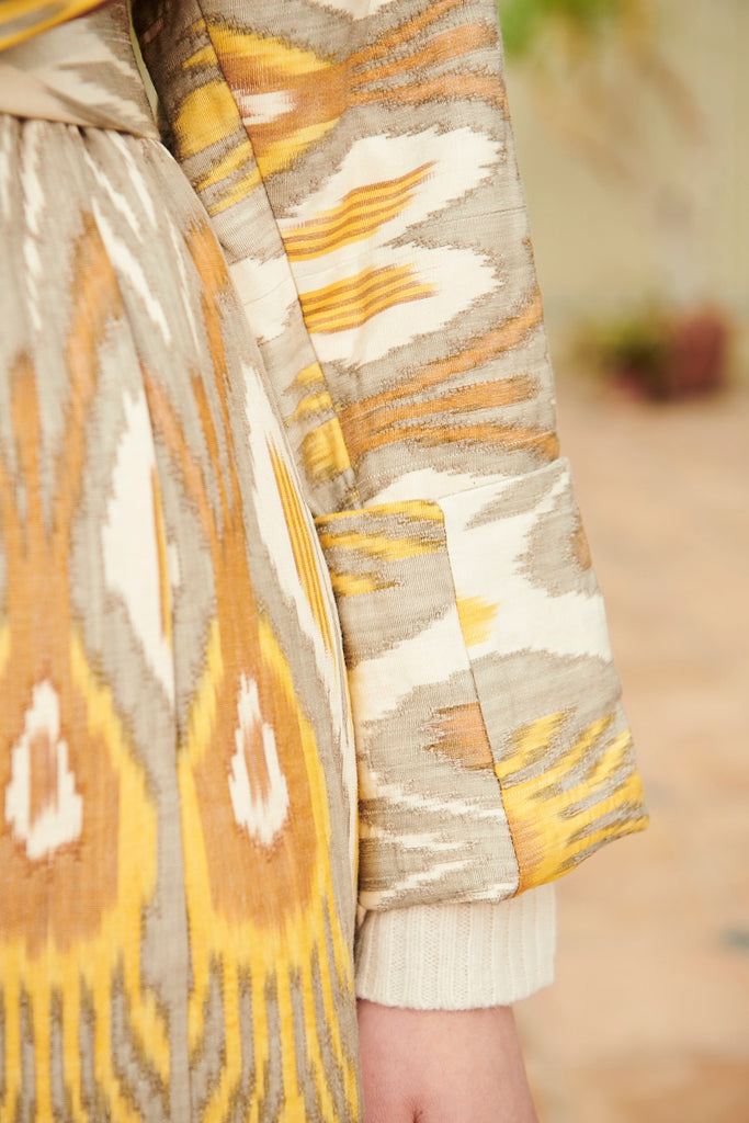 Close-up view of the sleeve on the Silk Ikat Chapan Coat – Nargiza 