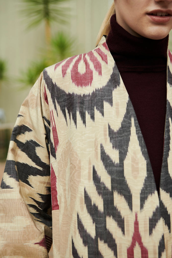 Close-up view of the design on Anor’s traditional Uzbek Chapan Silk Ikat Coat - Nilufar