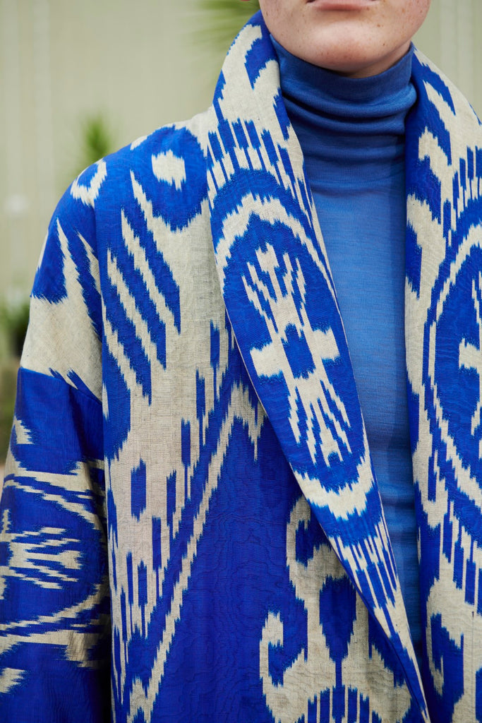 Close-up collar view of a model wearing a Silk Ikat Shawl Coat – Shahlo, hand woven by the artisans of Uzbekistan