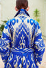 Back view of a model wearing a Silk Ikat Shawl Coat – Shahlo, hand woven by the artisans of Uzbekistan