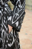 Close-up view of a model wearing a Silk Ikat Shawl Coat - Latifa