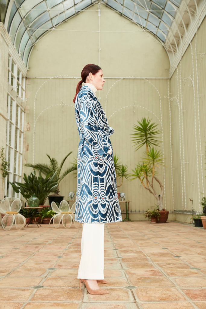 Side view of a model wearing the Silk Velvet Ikat Shawl Coat - Camila