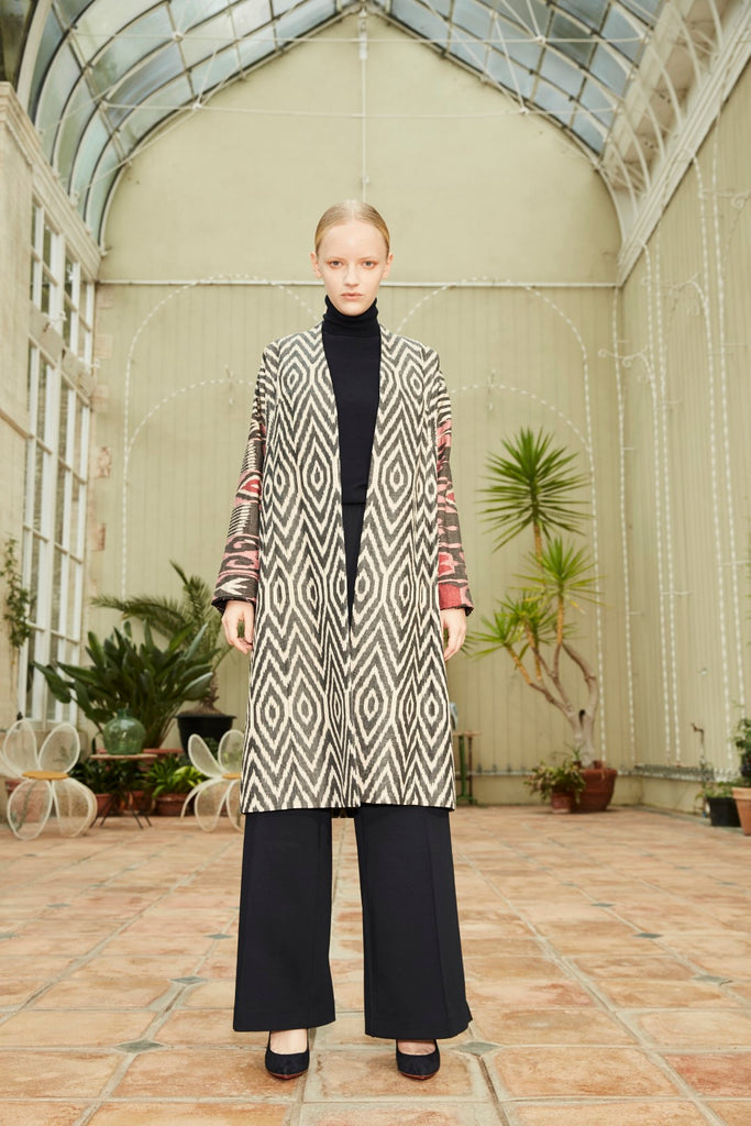 Model wearing Anor’s Silk Ikat Chapan Coat – Zarina with a 100% silk lining