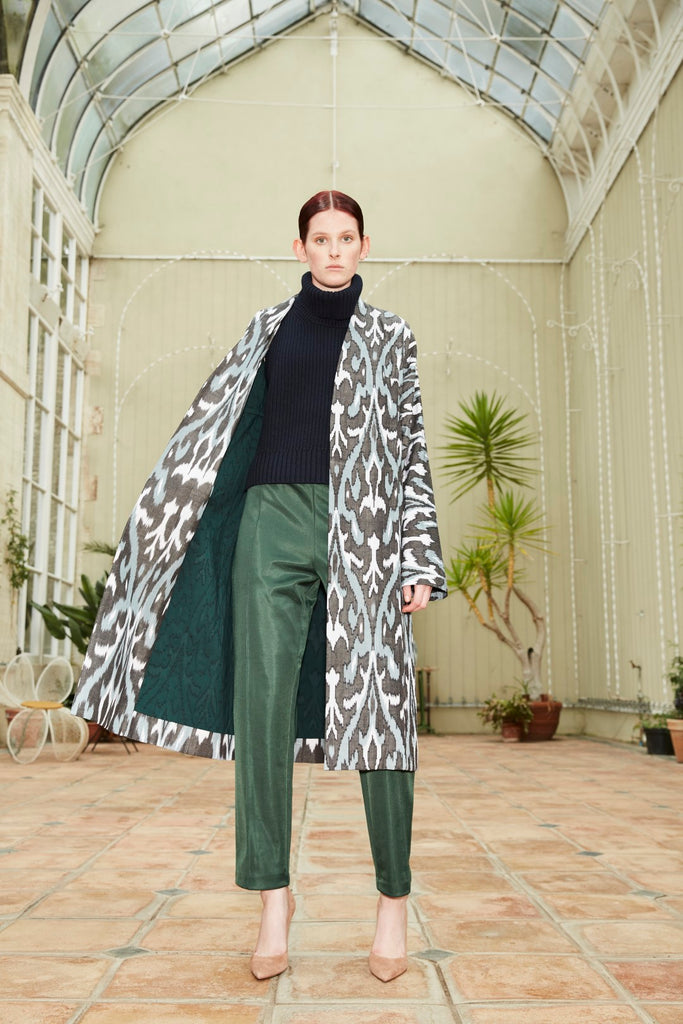 Model wearing Anor’s Silk Ikat Chapan Coat – Zamira with a dark green 100% silk lining