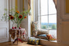 Image showing four beautiful Silk Ikat cushions by a window next to a flower vase