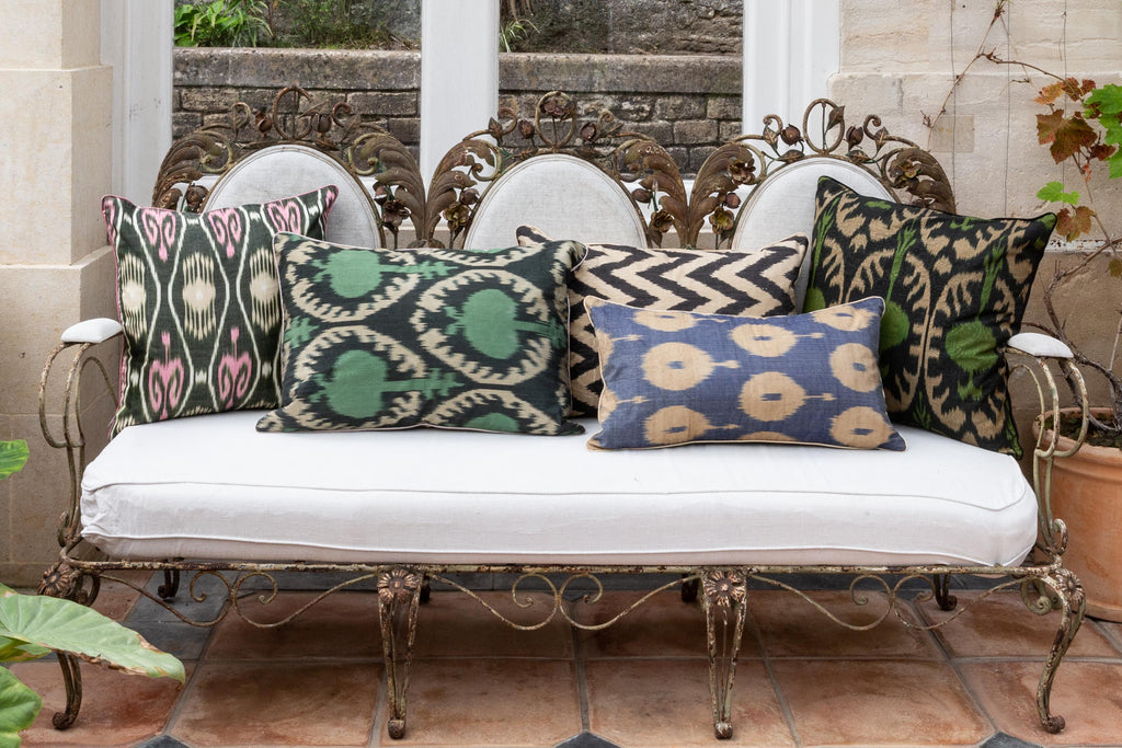 View of the beautiful Dark Blue and Cream Rectangle Silk Ikat Cushions on a beautiful metal-frame sofa amongst other Silk Ikat cushions. 